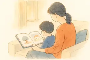 夕方のリビングで子どもと絵本を開く母親の手元